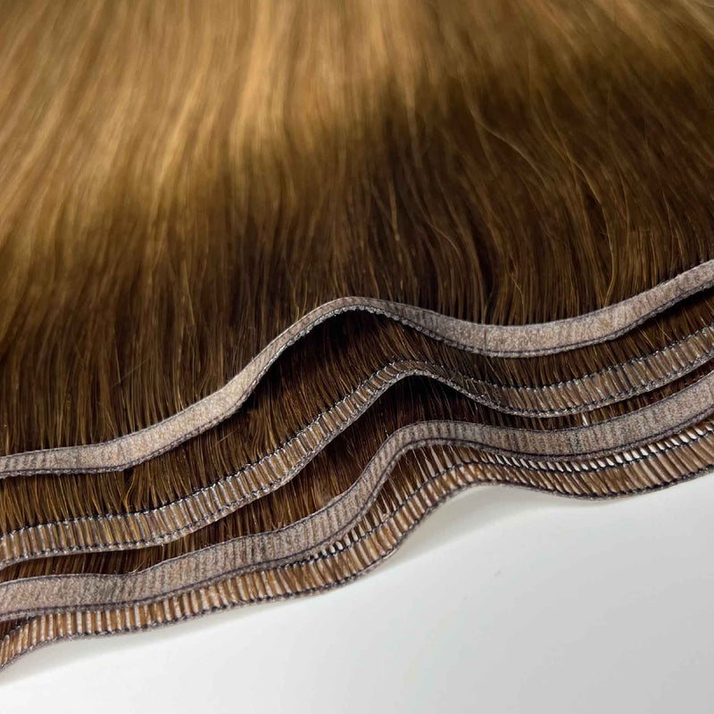 Human tape weft hair extensions UK available in #613 bleach blonde sunny haze